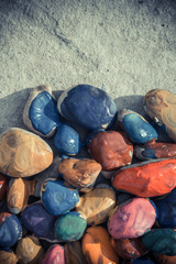 stones with a smooth surface painted colorful paint