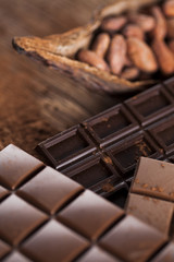 Chocolate bar, candy sweet, dessert food on wooden background