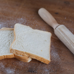baked bread on wooden table background