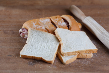 baked bread on wooden table background