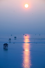 Sunrise time Thai fisherman village in Bangtaboon Petchaburi, Thailand