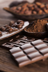Chocolate bar, candy sweet, dessert food on wooden background