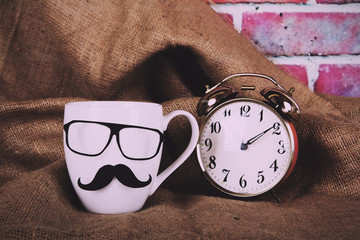 Coffee cup with a black hipster mustache  Vintage Retro Filter.