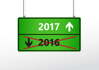 Green traffic sign with upcoming 2017 and cross out 2016 year wi