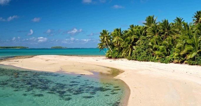Aerial view of beautiful tropical island lagoon and white sand beach in the South Pacific