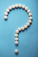 pills in the form of question mark