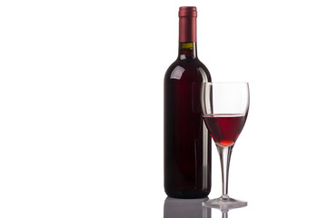 Red wine glass and bottle isolated on white background