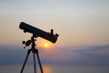 telescope silhouette at sunset background