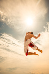 male beach volleyball game player jump on hot sand