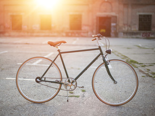 Naklejka na ściany i meble Fixie bicycle on sun light