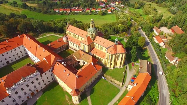 Camera flight over Benedictine monastery in Kladruby. Baroque architecture in Czech Republic. European landmarks from above.
