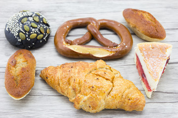 Tasty bread on wooden background