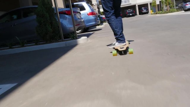 A few kids cruising the city, some on skateboards.