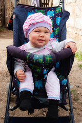 Little girl in pram