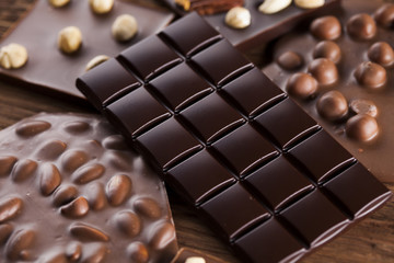 Bars Chocolate , candy sweet, dessert food on wooden background