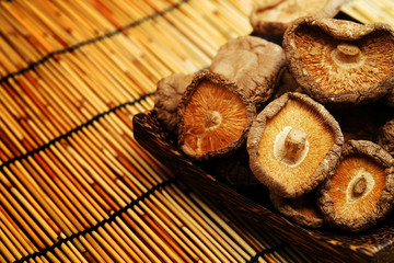 Dried Shiitake Mushroom on mat earth tone background