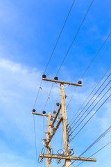electricity post against blue sky