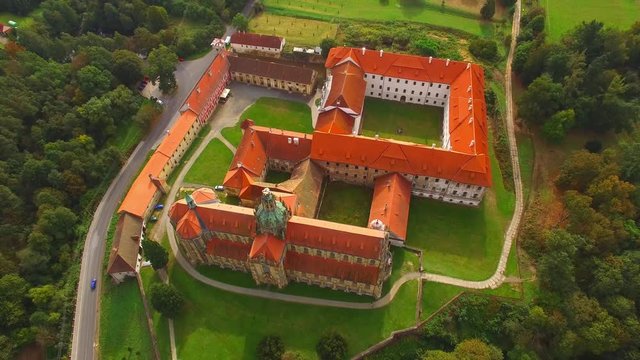 Camera flight over Benedictine monastery in Kladruby. Baroque architecture in Czech Republic. European landmarks from above.