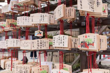 Tourist are hanging the Wooden tags in Dazaifu Shrine for good luck.