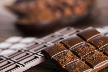 Bars Chocolate , candy sweet, dessert food on wooden background