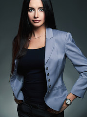 fashion business woman in a suit.elegantly dressed young brunette lady