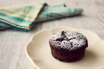 Chocolate Souffle with powdered sugar.