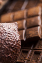 Dark and milk chocolate bar on a wooden table