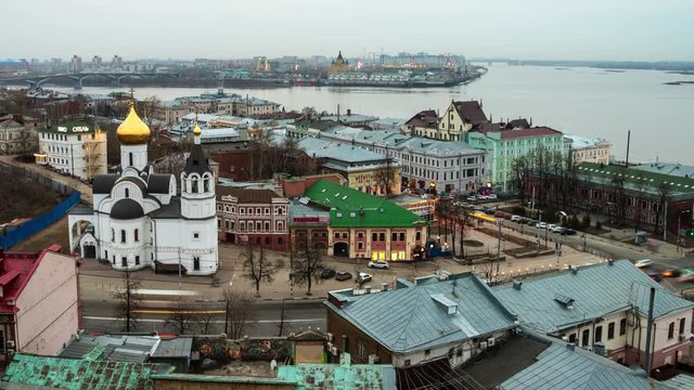 Nizhny Novgorod, Russia. Aerial view of illuminated historical buildings at night with river. Day to night time-lapse