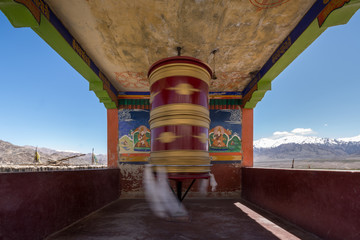 Spinning prayer wheels at Thikse Monastery