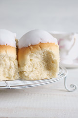 Iced buns or fingers a brioche style bun covered with icing