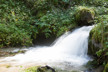 small waterfall with splashes