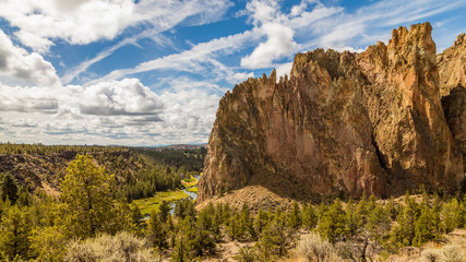 The river is flowing among the rocks. Colorful Canyon. Amazing landscape of yellow sharp cliffs. Smith Rock state park, Oregon