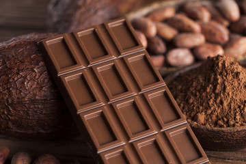 Cocoa pod and chocolate bar and food dessert background