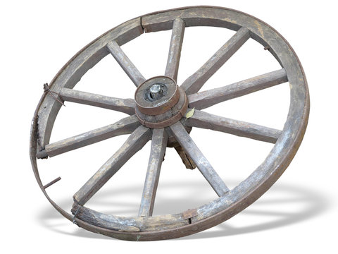 Antique Cart Wheel made of wood and iron-lined isolated over whi