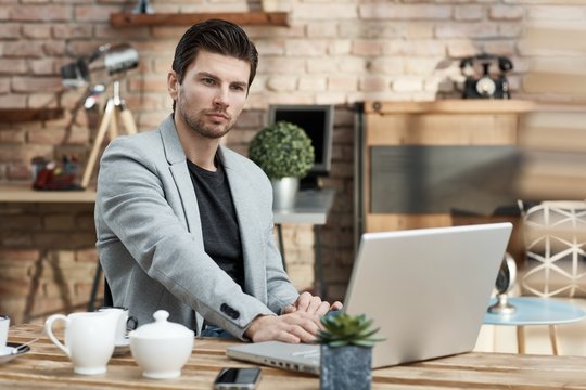Young businessman working with laptop computer