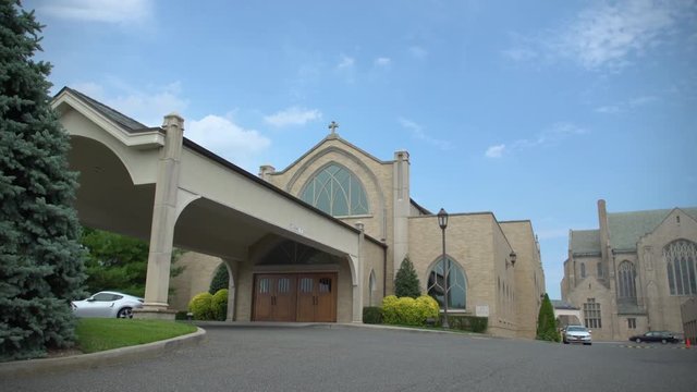 Religious building with expensive car in front