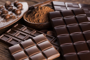 Chocolate bar, candy sweet, dessert food on wooden background