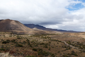 Dry river leading to the mountains on the way to Fraserburg