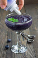 Healthy boiled egg blueberry mousse with whipping cream in glass