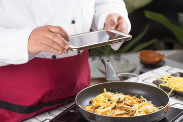 Chef take photo with Tablet