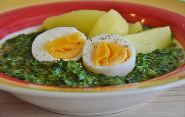 Green soup with eggs