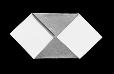 old ripped cardboard on black background