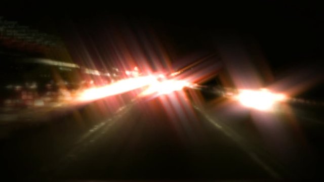 A time lapse shot of traffic on a metropolitan freeway with star filter. HD 1080.