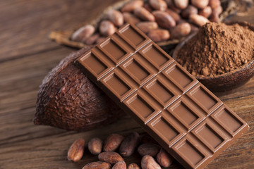 Cocoa pod and chocolate bar and food dessert background