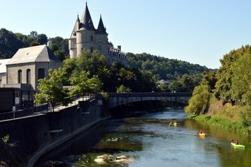 Fototapeta na wymiar Castle overhanging a river.