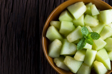 Fresh melon sliced on wooden table. Melon sliced.