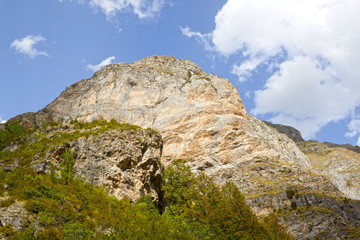 peak of a mountain with the sun over it