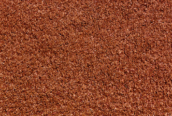 Decorative red grass loan texture. Sport and leisure.