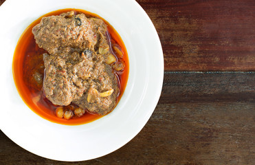 Beef massaman curry on wood background.