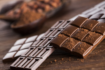 Bars Chocolate , candy sweet, dessert food on wooden background